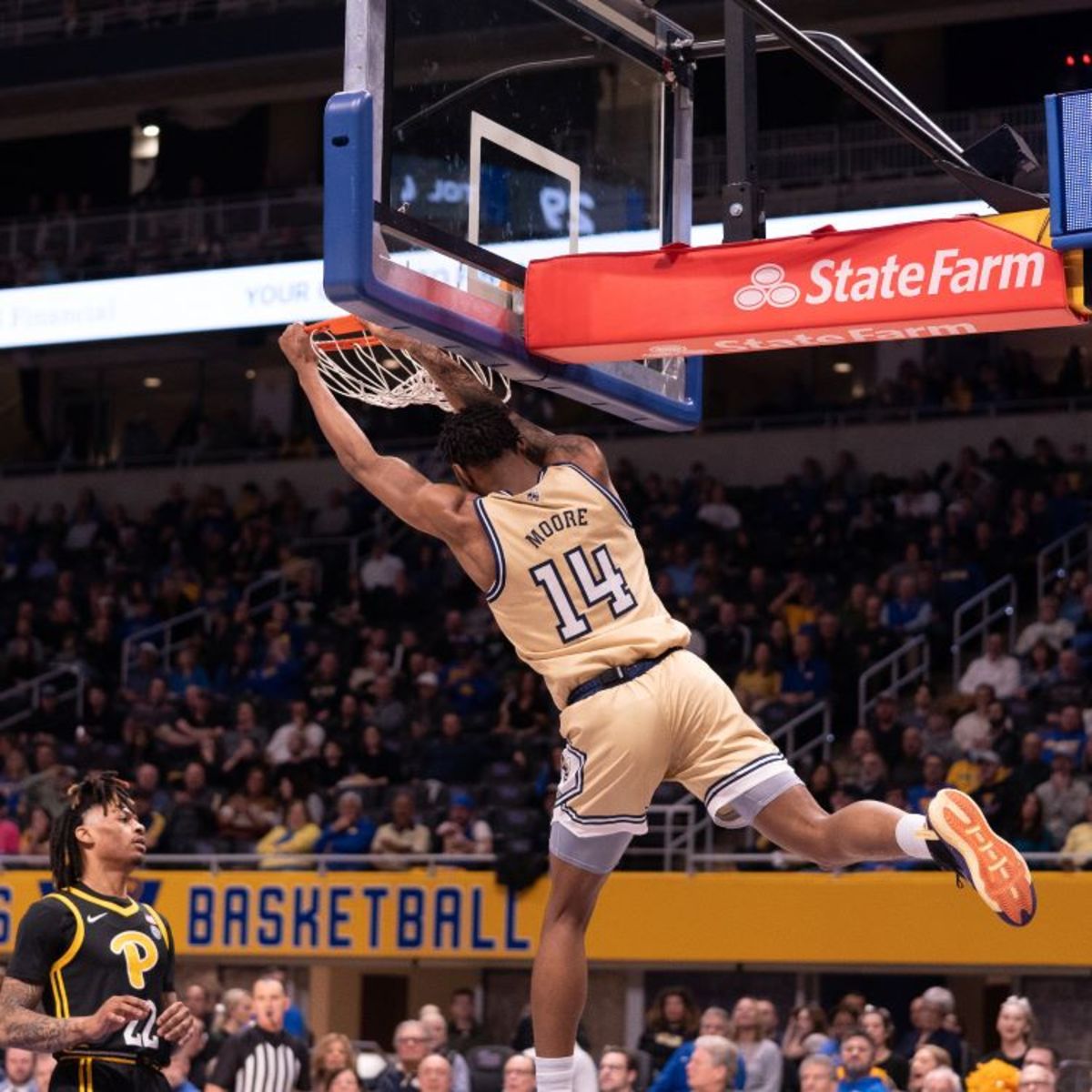 Jalon Moore dunking the basketball